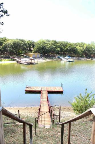 Lakefront Dock Fire Pit Sleeps 8 in Nocona, USA