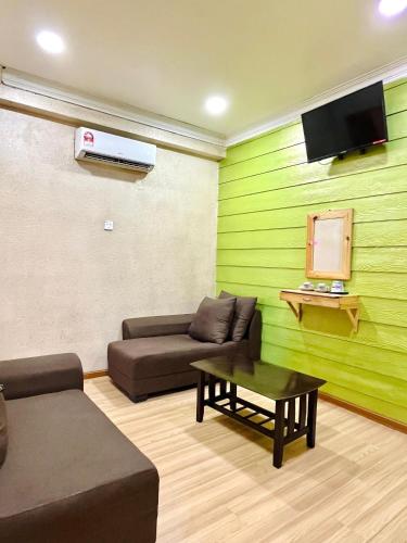 ห้องส่วนกลางสำหรับนั่งเล่น/ดูทีวี, Suza Hostel in ตุมปัต