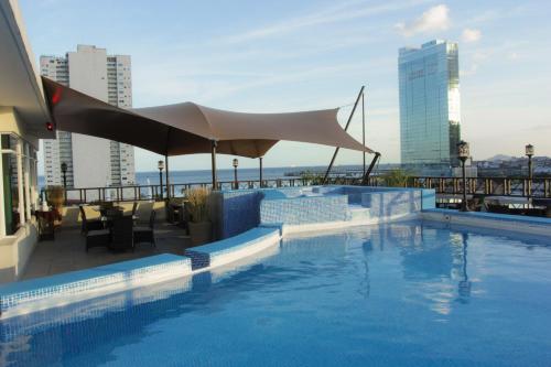 Hotel Bahía Suites - Tap to explore photos