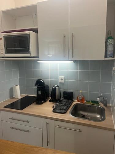 Appartement lumineux en rez-de- jardin Appartement lumineux en rez-de- jardin