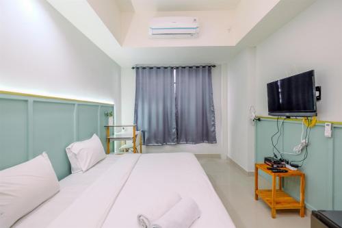 Minimalist Studio Apartment at Evenciio Margonda By Travelio, Depok