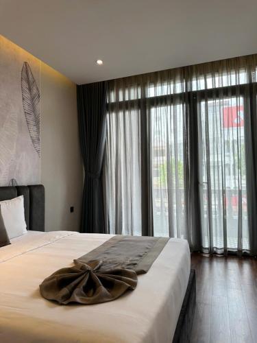 Quadruple Room with Balcony room in LION 11 Can Tho Hotel