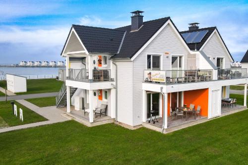 Unterkunft von außen, Fewo MEERwert by Seeblick Ferien ORO, Familienfreundlich, Sauna, Kamin,XL Dusche in Olpenitz