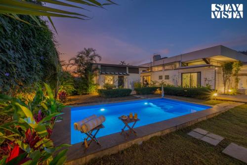 Serene Garden by VEO - Part of StayVista with Pool and Lawn area