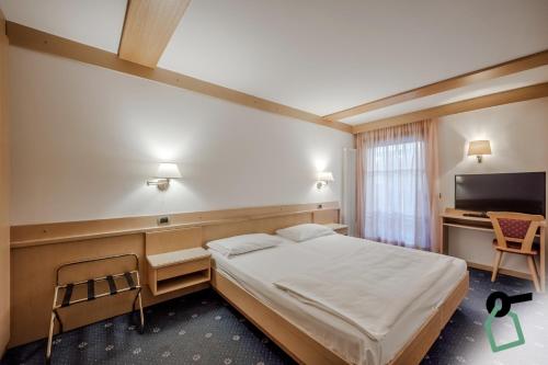 HOTIDAY Room Collection - Campitello Hotel de charme Campitello di Fassa