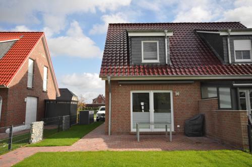 Nr 128 - Ferienhaus "Watt'n Glück" Cliner Straat in Carolinensiel, Deutschland