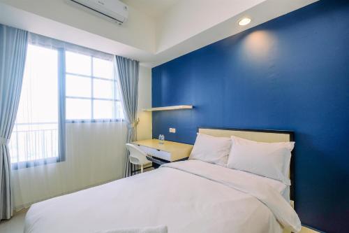 Elegant Studio at Evenciio Margonda Apartment By Travelio