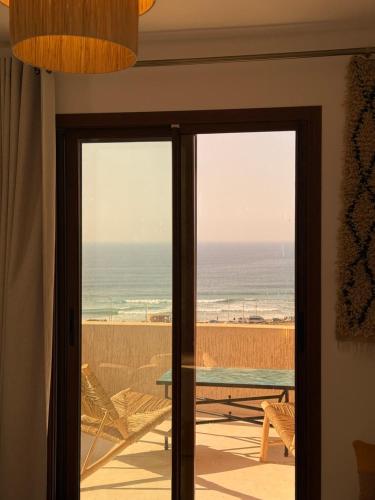 Aman surf paddle yoga in Imsouane