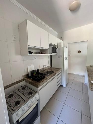 Konyha, Lazer completo e ar condicionado nos quartos in Praia Grande