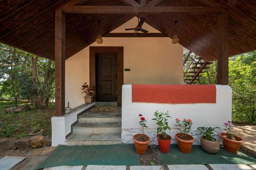 Exterior view, SaffronStays Raanwaara Luxe - 2BR villa with dual balcony jacuzzis, infinity swing & private waterfa near Tung Fort
