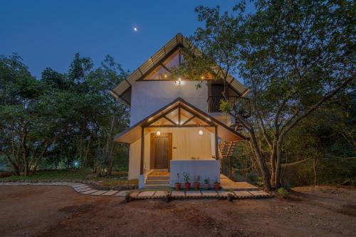 Exterior view, SaffronStays Raanwaara Luxe - 2BR villa with dual balcony jacuzzis, infinity swing & private waterfa near Tung Fort