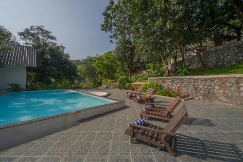 View, SaffronStays Raanwaara Luxe - 2BR villa with dual balcony jacuzzis, infinity swing & private waterfa near Tung Fort