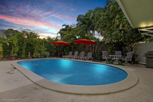 Tropical 3BR Escape with Pool, 7 Min Drive to Beach