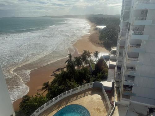 Kolam renang, Beachfront Apartment in Luquillo at Sandy Hills in Luquillo