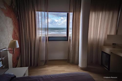 Habitación triple, vistas al mar