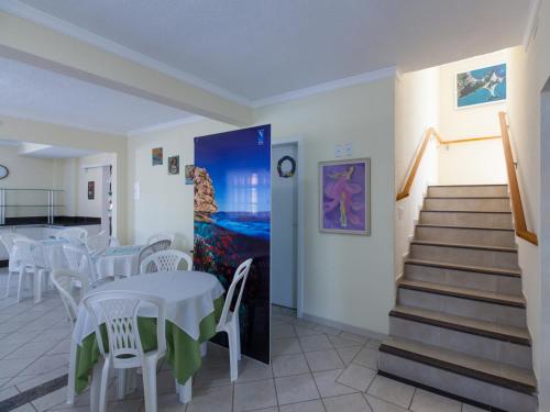 Lounge/area TV in comune, Bombinhas Praia Apart Hotel - Unidade rua Corrupiao in Bombinhas