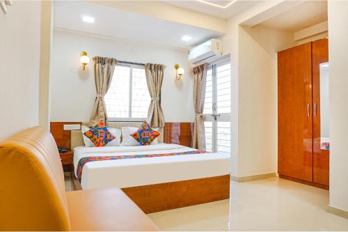 FabHotel Rising Surya - Nr Embassy Tech Zone