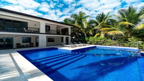 Beachfront Villa with Long Private Pier and Pool in Ambergris Caye