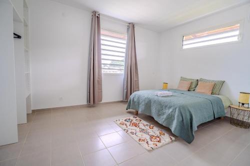 Ti'Paradis Rémire - 2 chambres - 5 min de la Plage - Wifi - Balcon - Adapté long séjour (Ti'Paradis Remire - 2 chambres - 5 min de la Plage - Wifi - Balcon - Adapte long sejour) in เรอมีร์-มงโฌลี