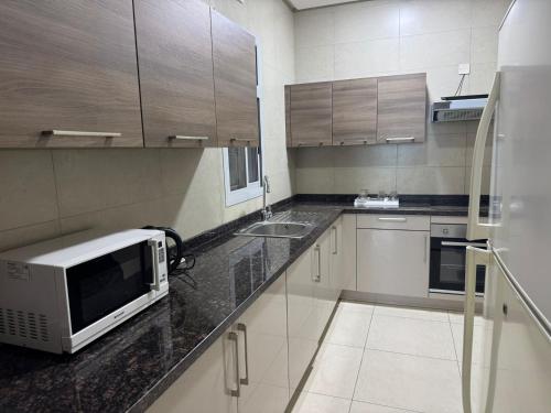 кухня, Marine Beach Apartment in Манама