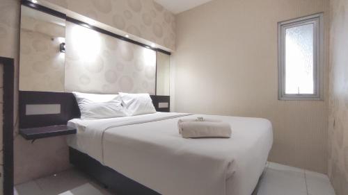Comfortable Living 2BR at Dian Regency Apartment By Travelio, Surabaya