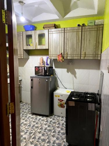 ห้องครัว, Koigi Apartment in ทิกา