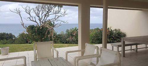 Shared lounge/TV area, Beach Golf Escape, your home away from home in Southbroom