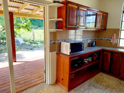 Dado's Place - 2 bedroom house with AC and verandah in Calibishie