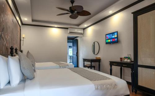Family Room with Balcony room in Luang Prabang Vang Luang Hotel