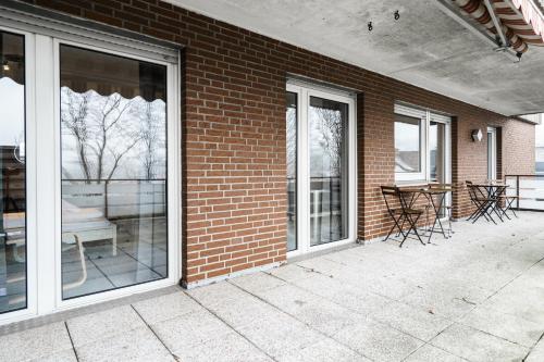 Erkély/terasz, Wooon I O105 XXL I 10 Personen I 4 Schlafzimmer I 160m2 I Smart I P I in Ibbenbüren