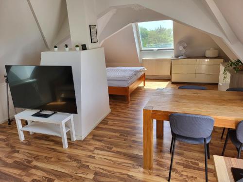 Dachgeschosswohnung 1 - Apartments am Schloss in Oberschleißheim, Deutschland