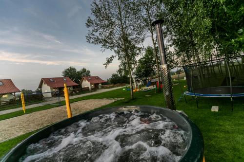 Exterior view of Ostoja Lemany - domki na Kaszubach, sauna, balia-jacuzzi, plac zabaw, tyrolka , dwa boiska, miejsce
