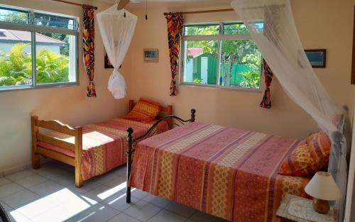 T2 Bas de villa Les Hibiscus in บัว โฌลอง