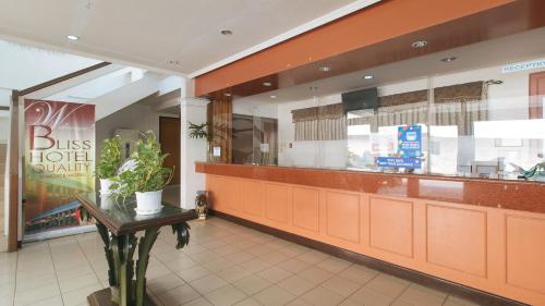 Capital O 740 Bliss Hotel Dau - Tap to explore photos