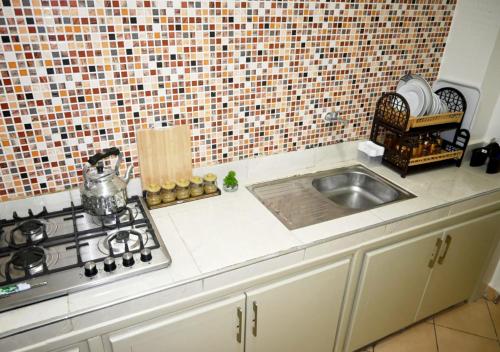 Kitchen, Hogar Feliz - apartment in Dcheira El Jihadia