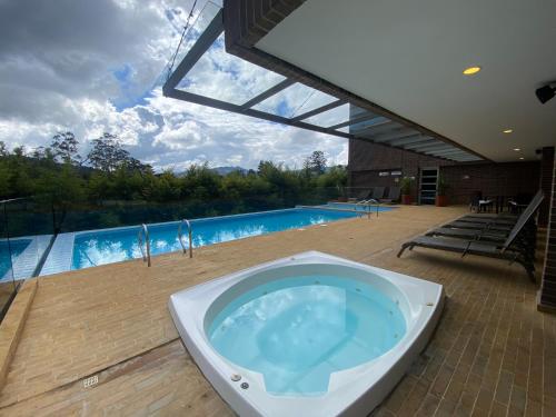 Peldbaseins, Suite de Lujo en Llano Grande con jacuzzi, Turco, Sauna y Gimnasio in Rio Negro