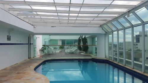 Swimming pool, Apartamento Temporada Guaruja Four Seasons in Morro do Maluf