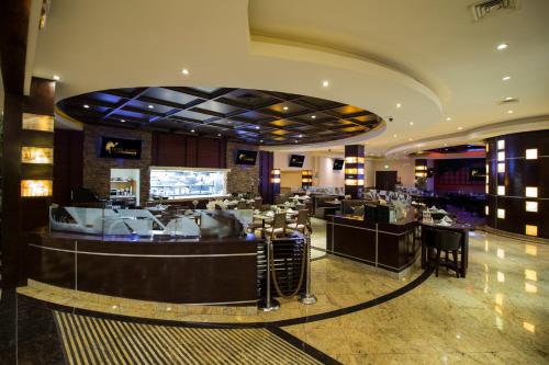 Restaurant, Hotel Ticuan near Las Americas Premium Outlets