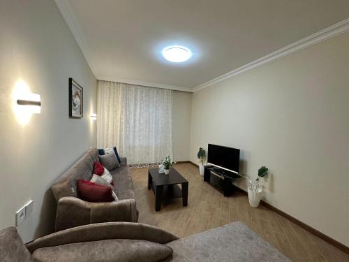 gedeelde lounge/tv-ruimte, Serenity Suites in Chilegir