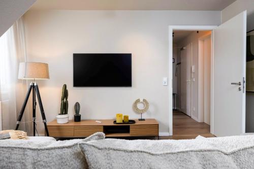 Jagatud salong / TV-ala, Apartment Suite von Spears - Edles Design mit Balkon und kostenloser Tiefgarage im Neuseenland in Markkleeberg
