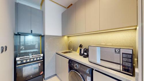 Vacationer Holiday Homes I Airy 1 Bedroom l Modern Finishes l Wi-Fi & Equipped Kitchen l Meydan, Dubái (foto 3)