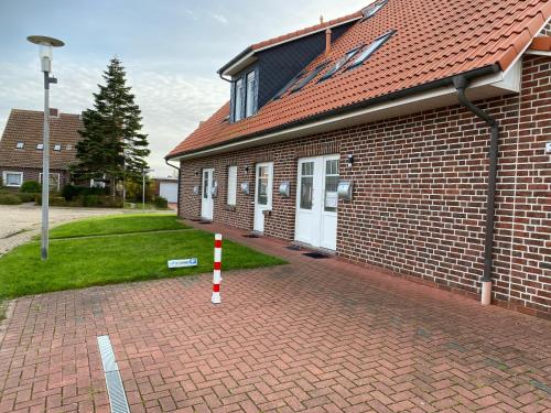 Entré, Ferienwohnung Seehundstr 1b in Norddeich