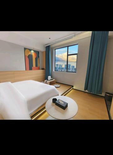 Orange Huaju Hotel - 图片 5