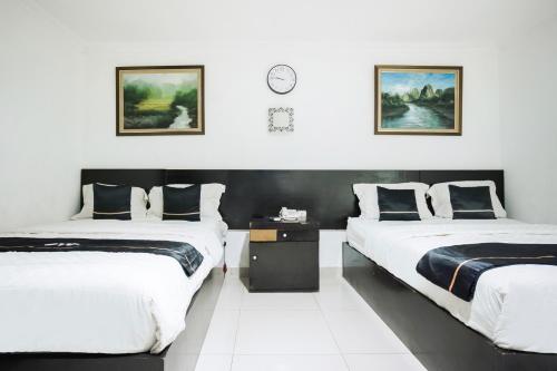Grand Malaka Ethical Hotel - Tap to explore photos