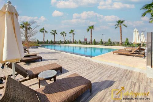 Swimming pool, Tranquil 3br Townhouse in Damac Hills2 by deleguest in Damac Hills 2