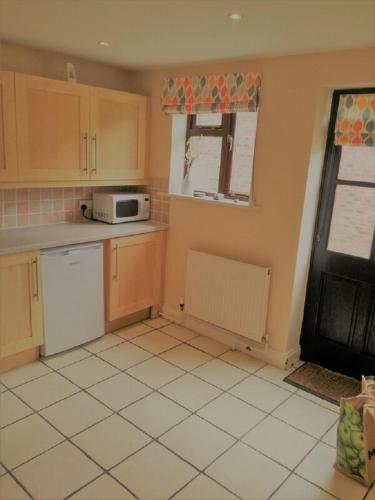 Kitchen, Riverside Cottage with free parking, overlooking the River Esk in Ruswarp