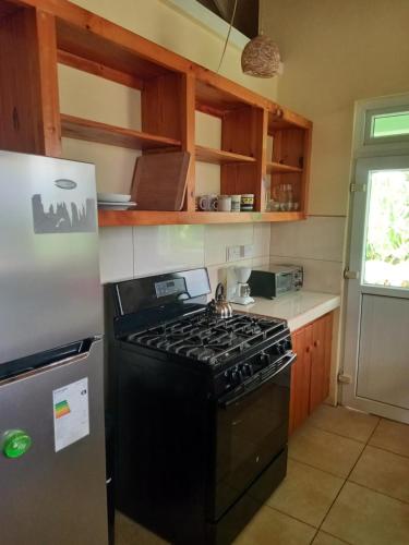 Kitchen, Villa Ora in Calibishie