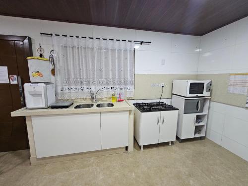 ห้องครัว, Hospedagem Costa BNU - Família (Hospedagem Costa BNU - Familia) in อิโตวปาวาซิงยา