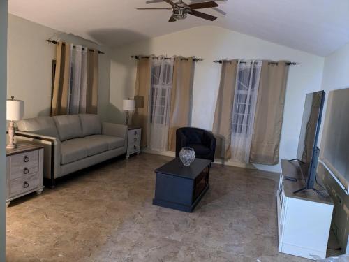 Shared lounge/TV area, BridgeView Arcadia Two in Portmore