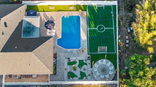 Resort Villa! Heated Pool with Golf plus Firepit and Turf Sports